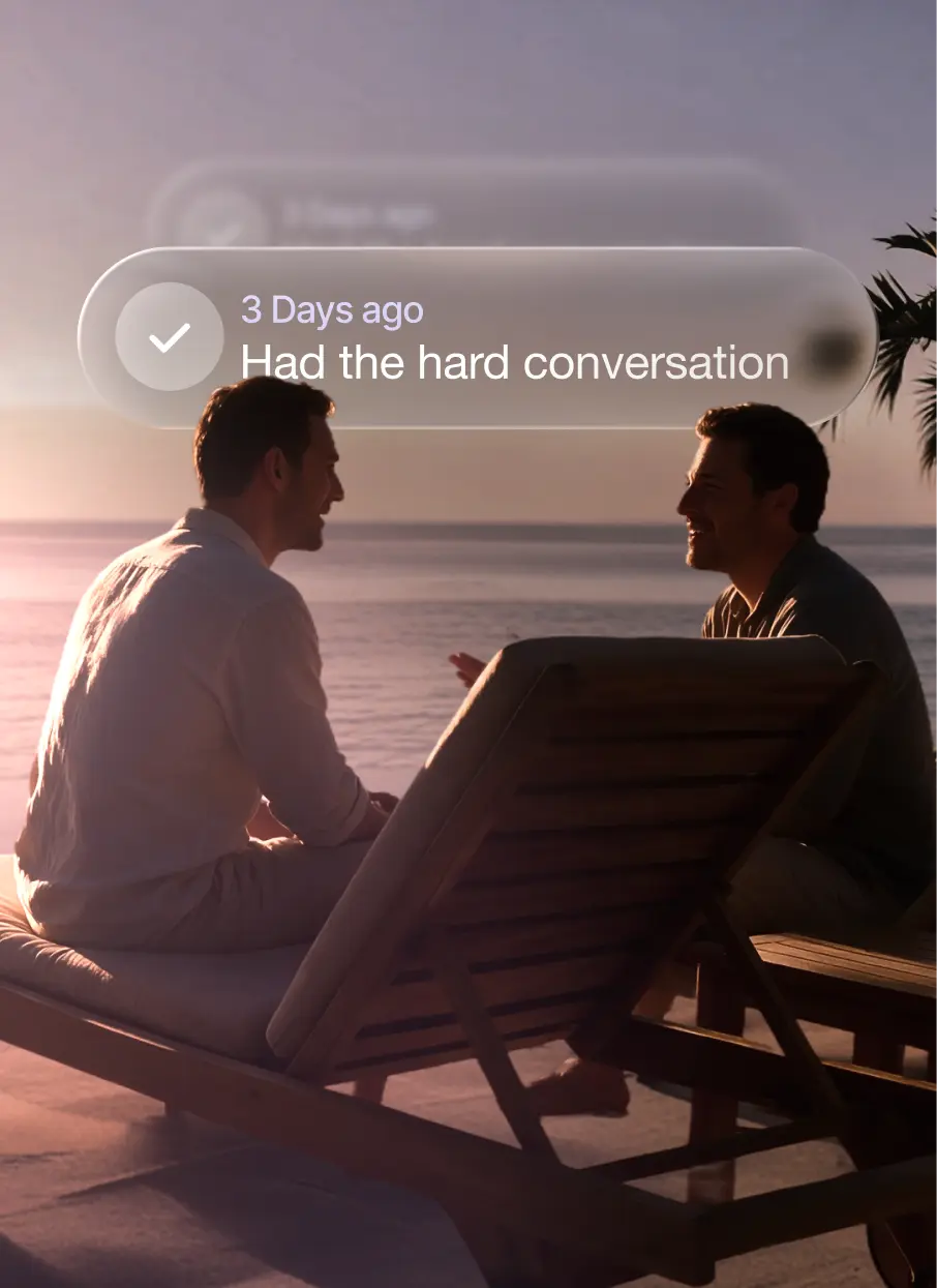 Two men talking by the sea